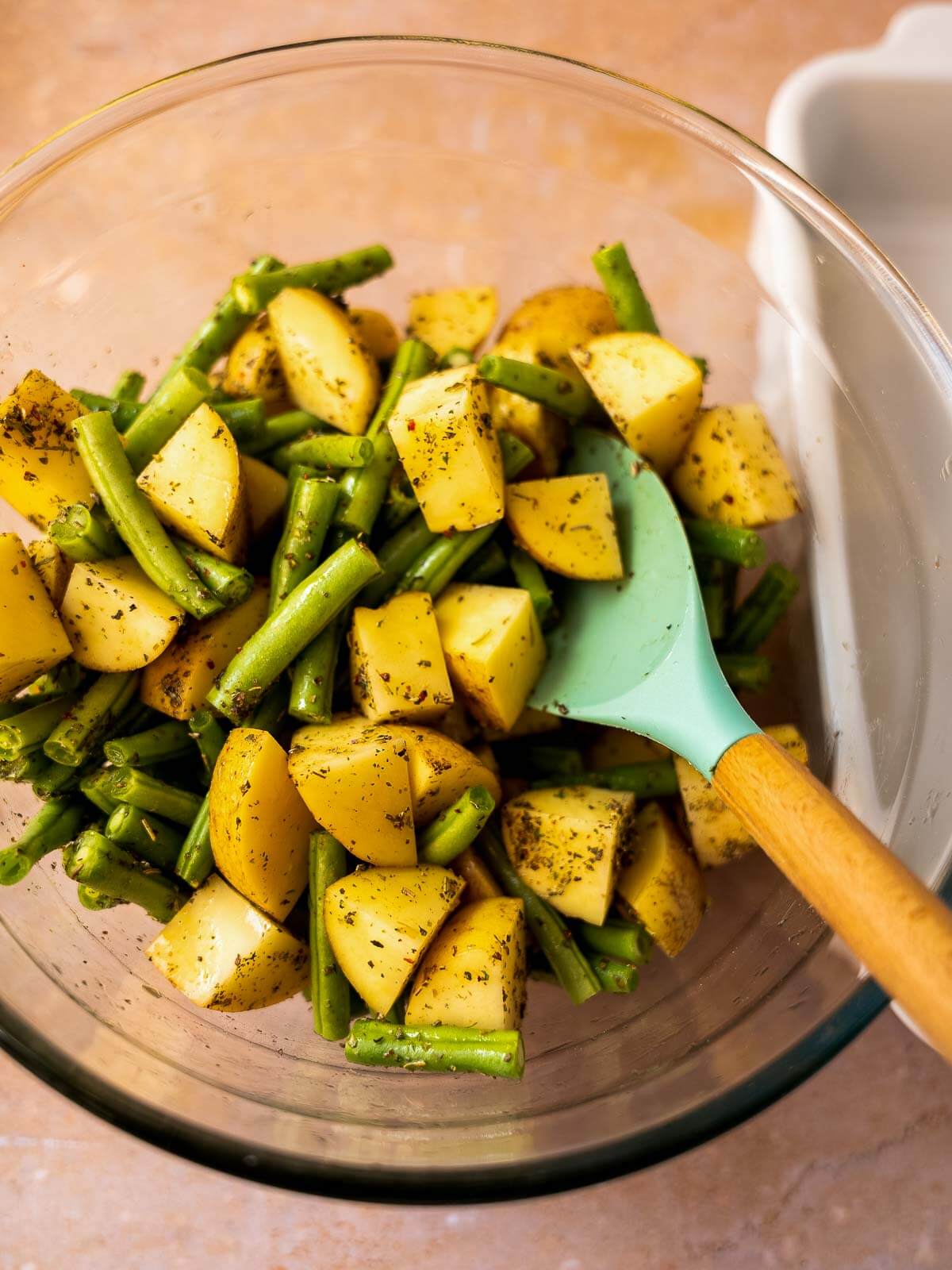 stir well until the potatoes and green beans are well coated.