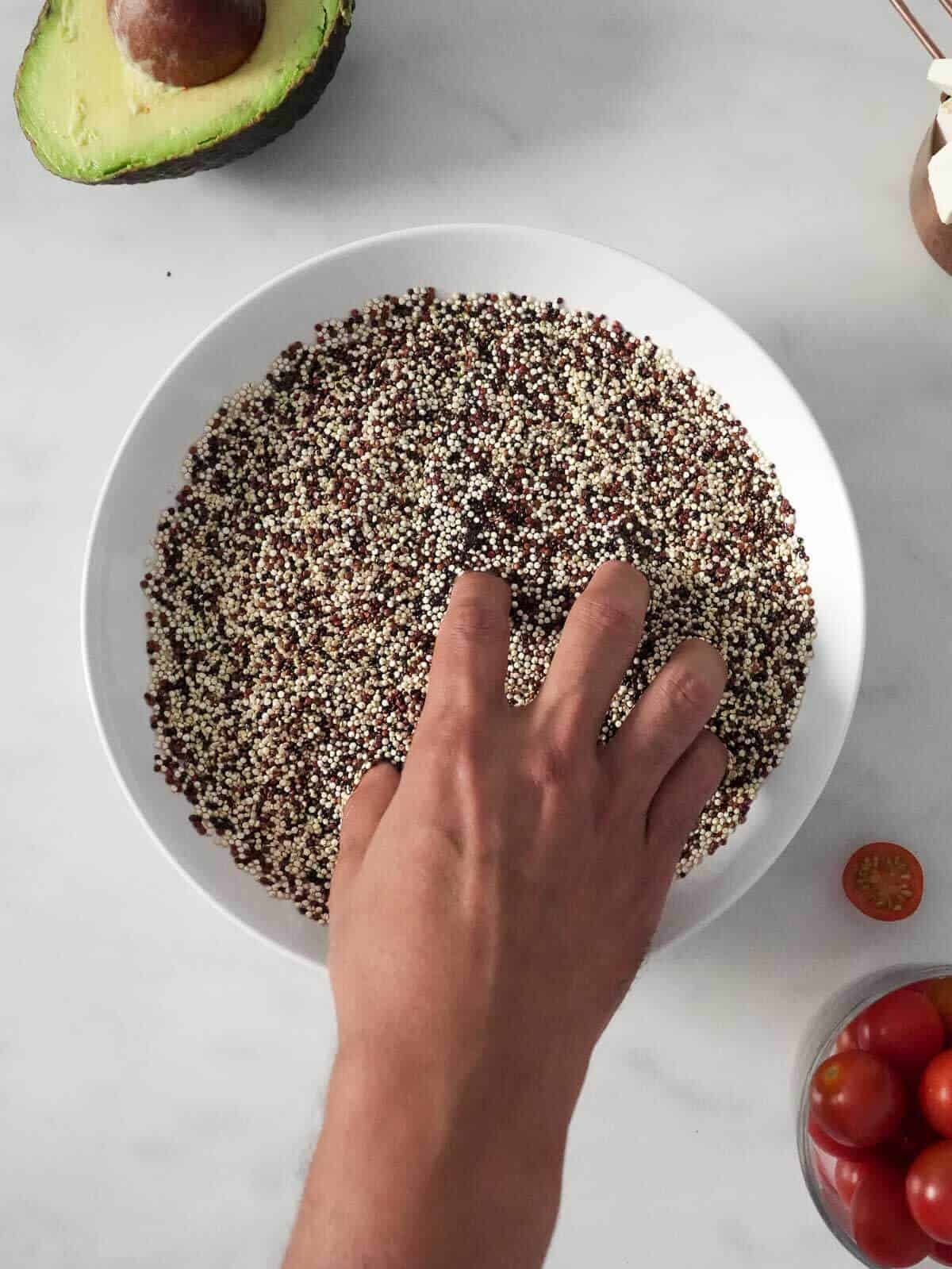 wash quinoa in a bowl with water.