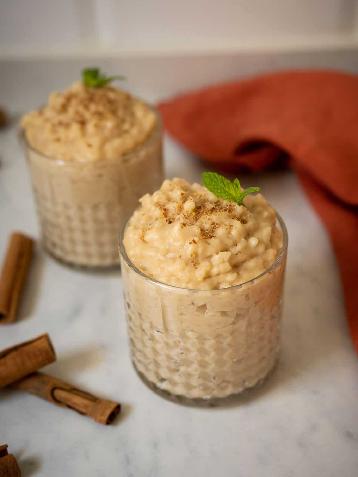 two portions of pudding in a serving glass.