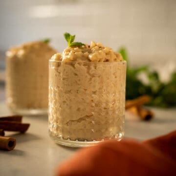 3 ingredient vegan rice pudding made with oat milk in a serving glass.