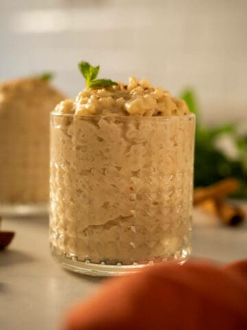 3 ingredient vegan rice pudding made with oat milk in a serving glass.