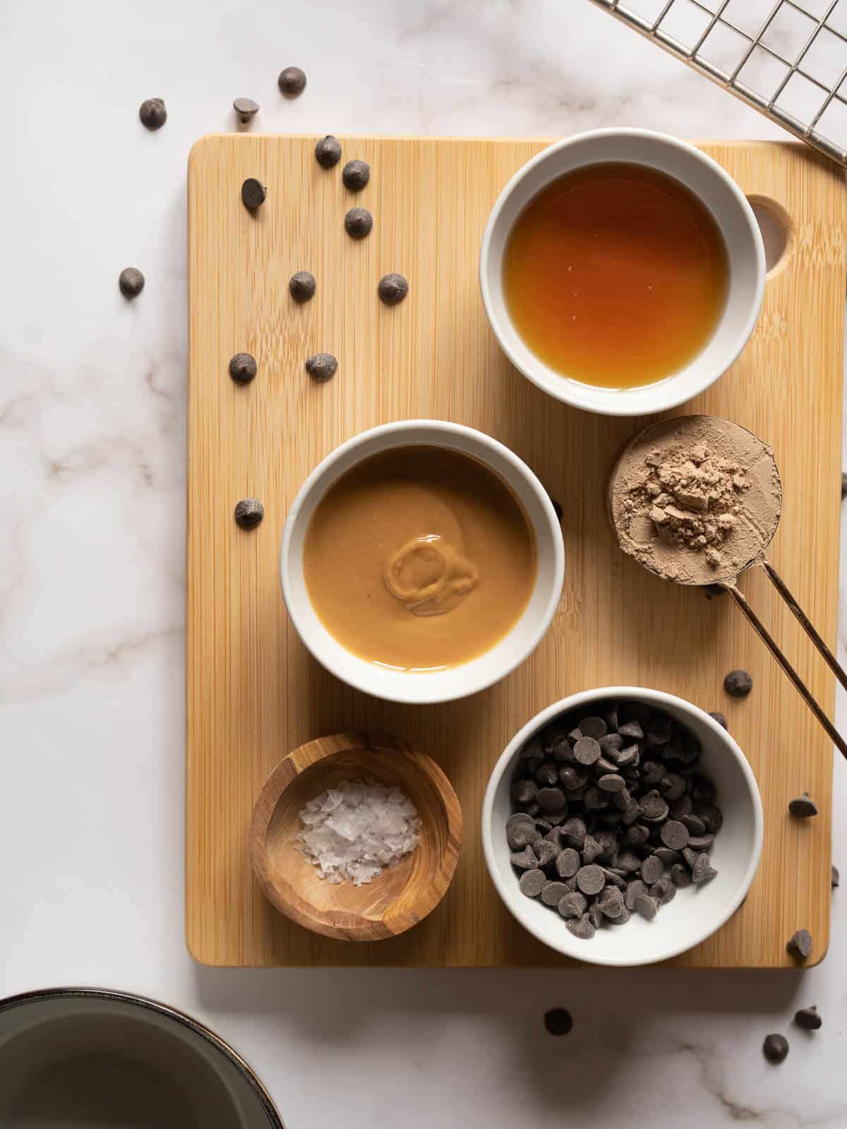 vegan protein cookies ingredients on a wooden choppin board.