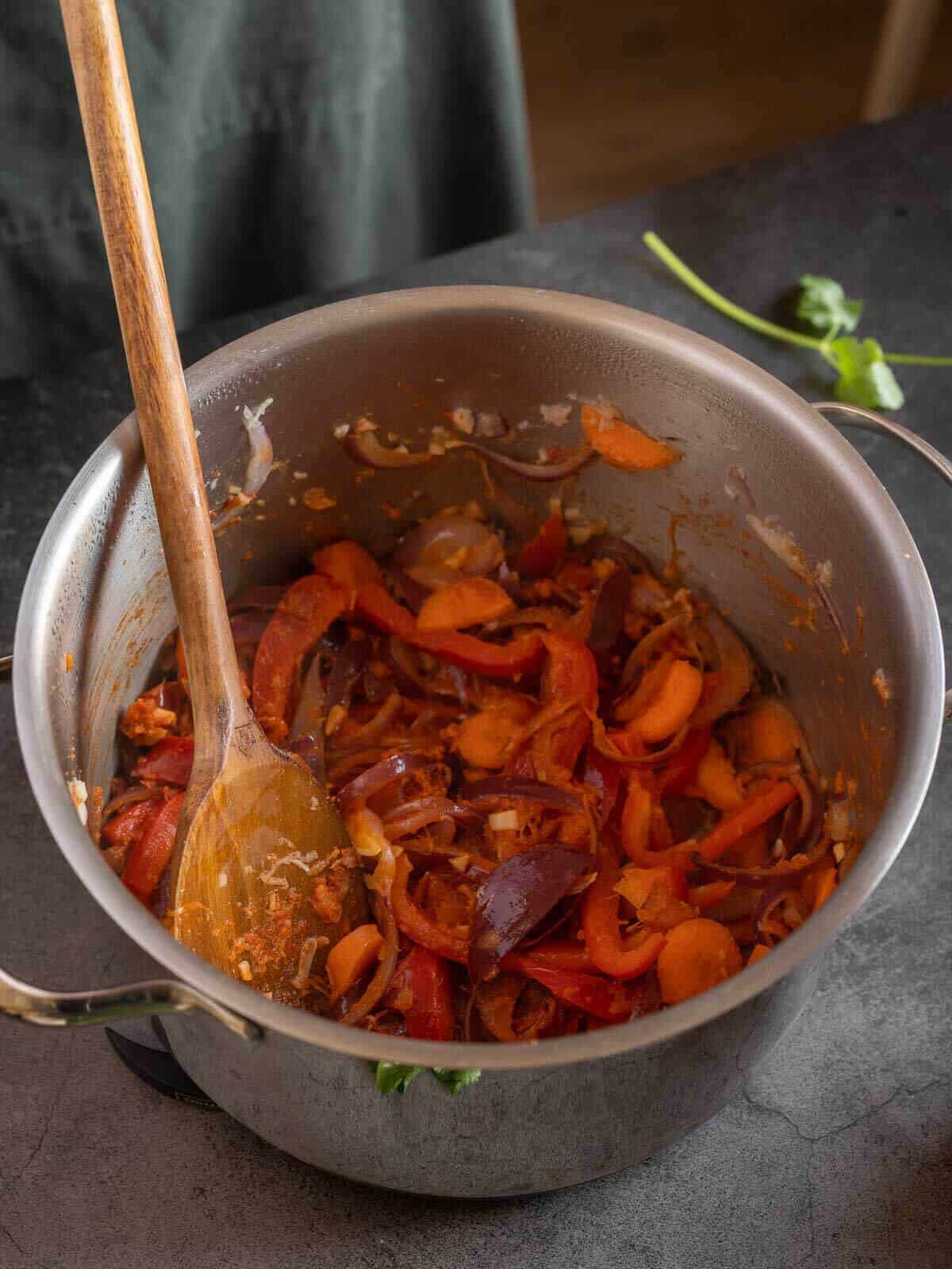 adding hard vegetables like carrots to the stir-fry.