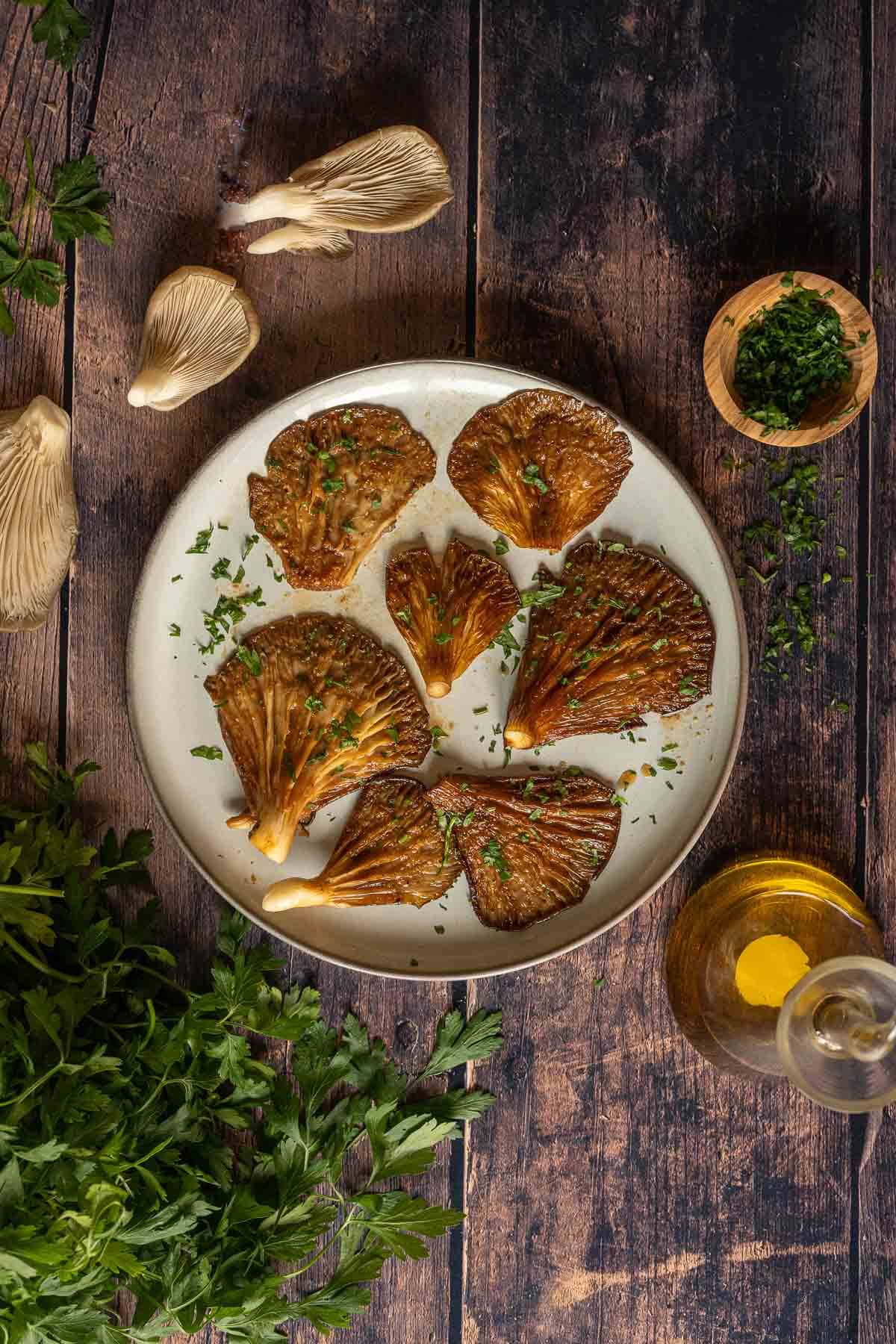 air fried oyster mushrooms served on a wooden table..