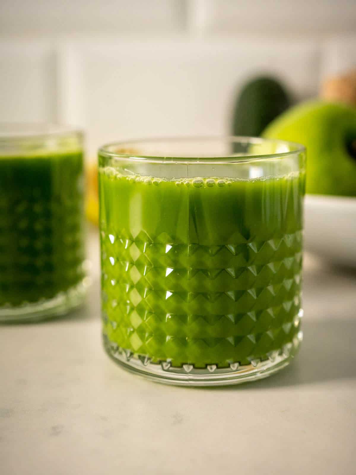 Hydrating Spinach and Green Mean apple juice glass.