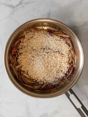 cook the rice with the onions until lightly toasted.