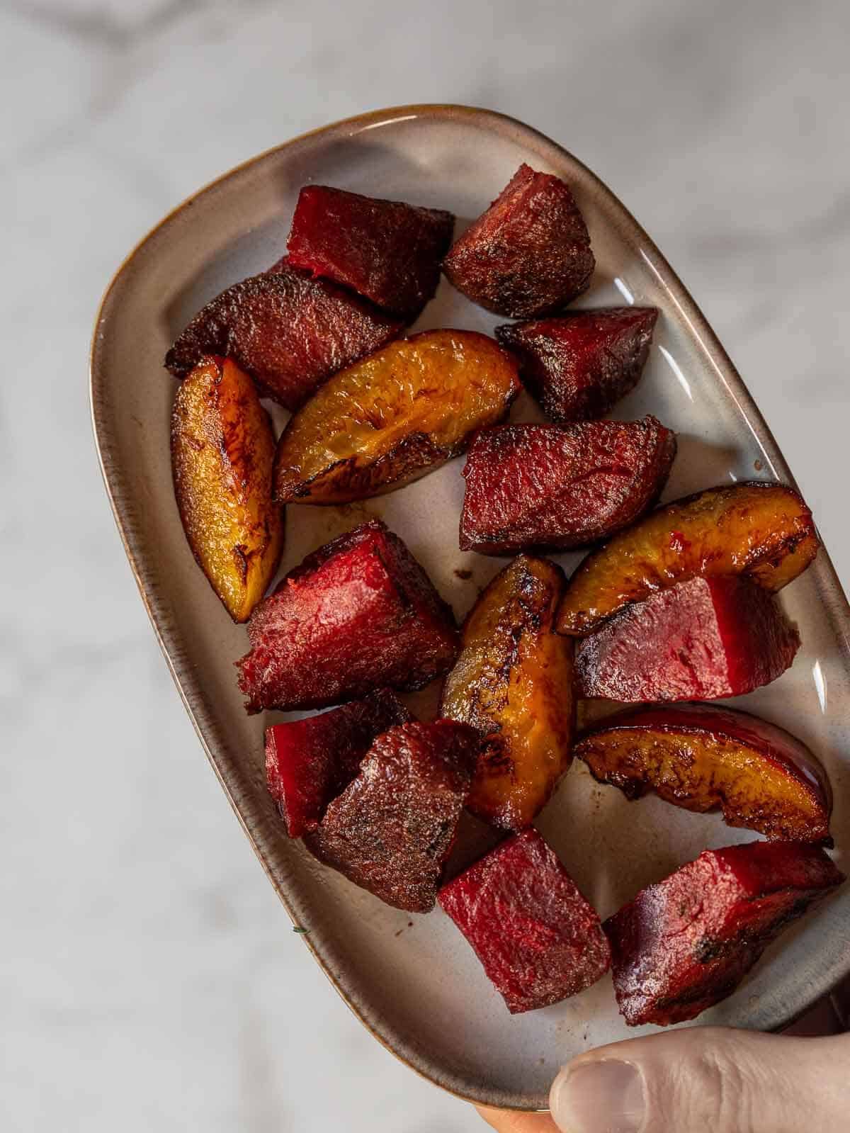 braised slices of beets and plums.