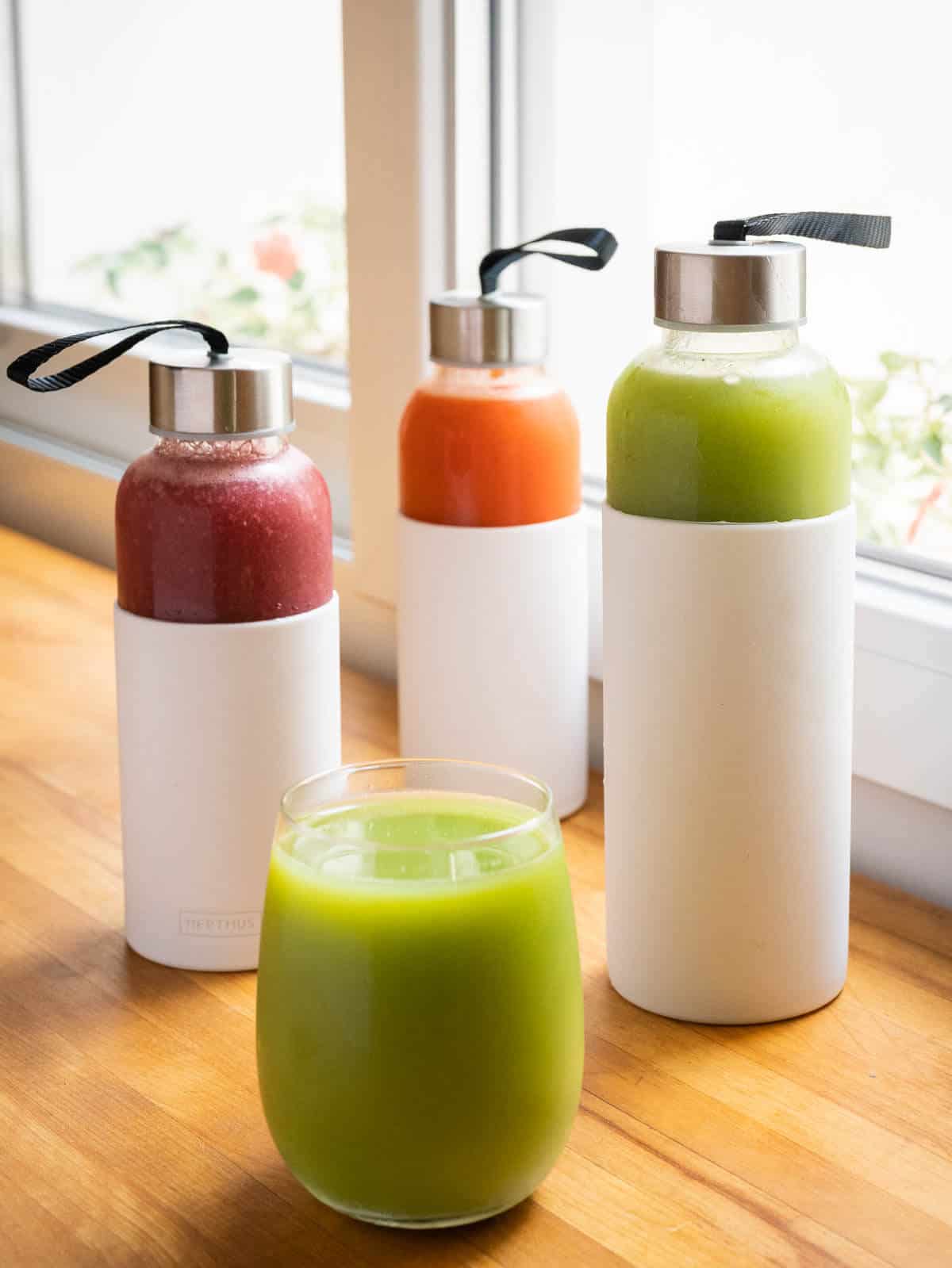 storing juice tips, three airtight glass containers with white silicon sheath.