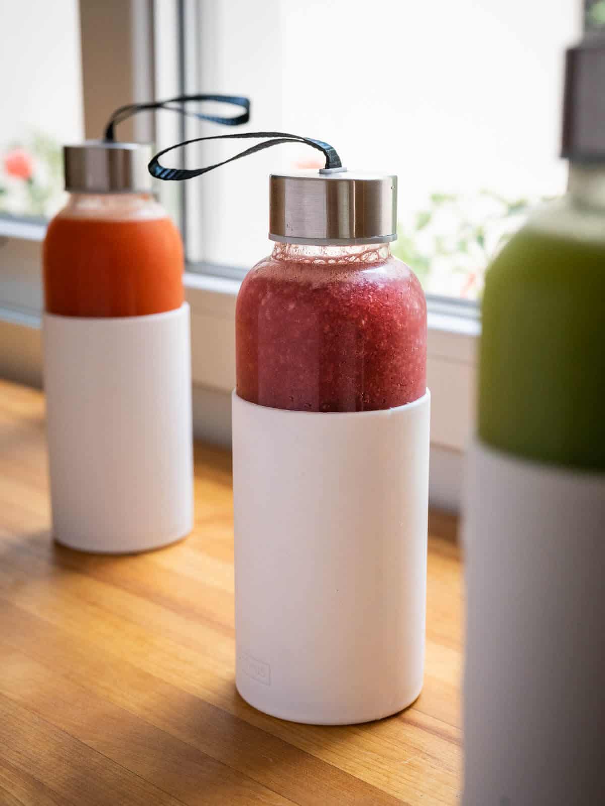 storing juice tips, three airtight glass containers with white silicon sheath.