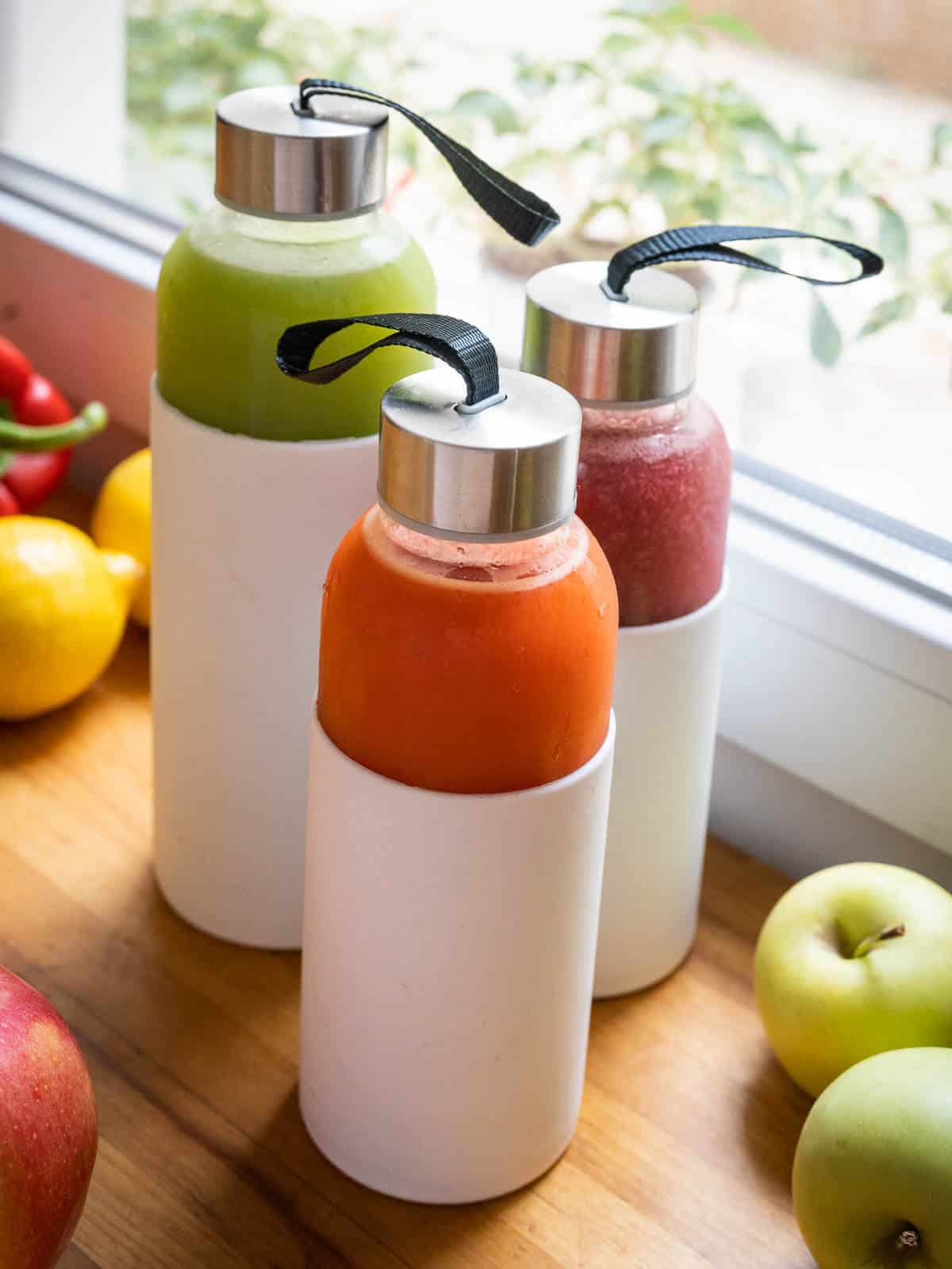 storing juice tips, three airtight glass containers with white silicon sheath.