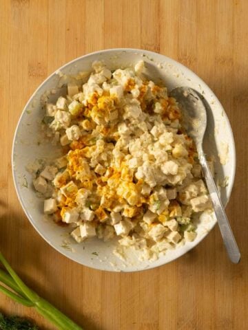 adding all the vegan egg salad mix into a bowl.