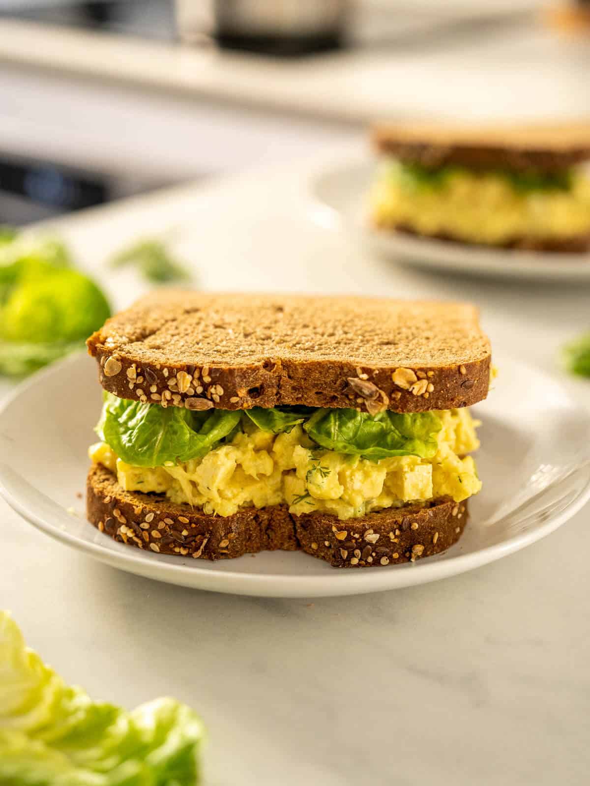 sandwich with vegan egg salad and lettuce.