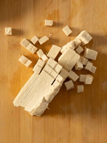 cube medium firm tofu into medium pieces.