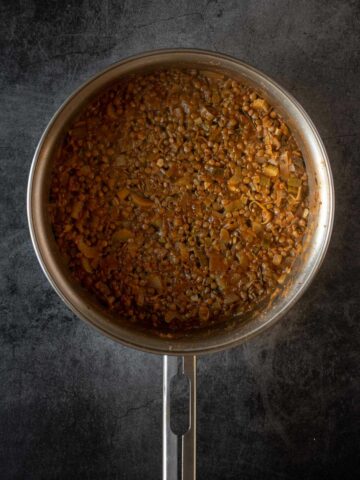 cook lentils until they are soft and the liquid completely consumed.
