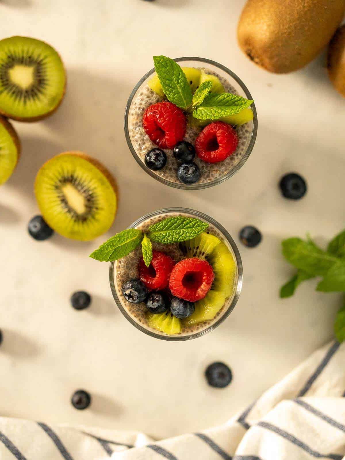garnished portions of oat milk chia puddings.