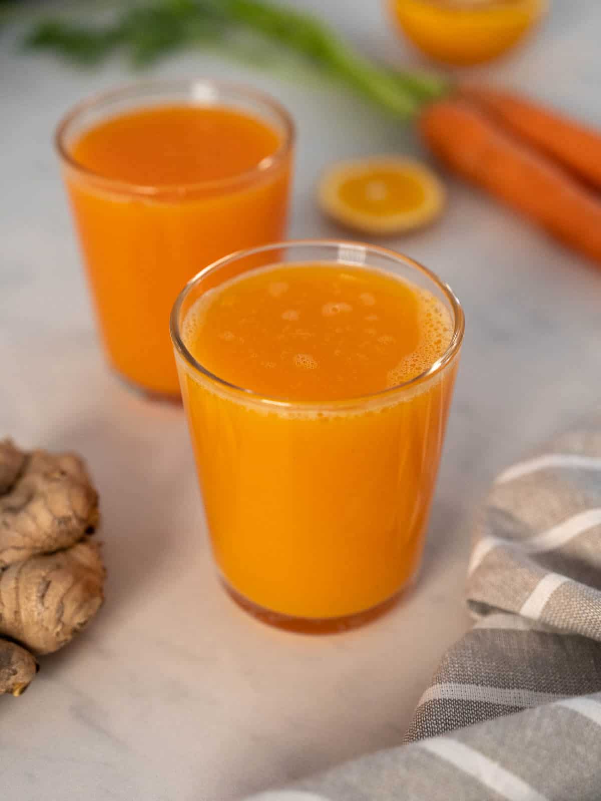 fresh carrot orange ginger juice hero.