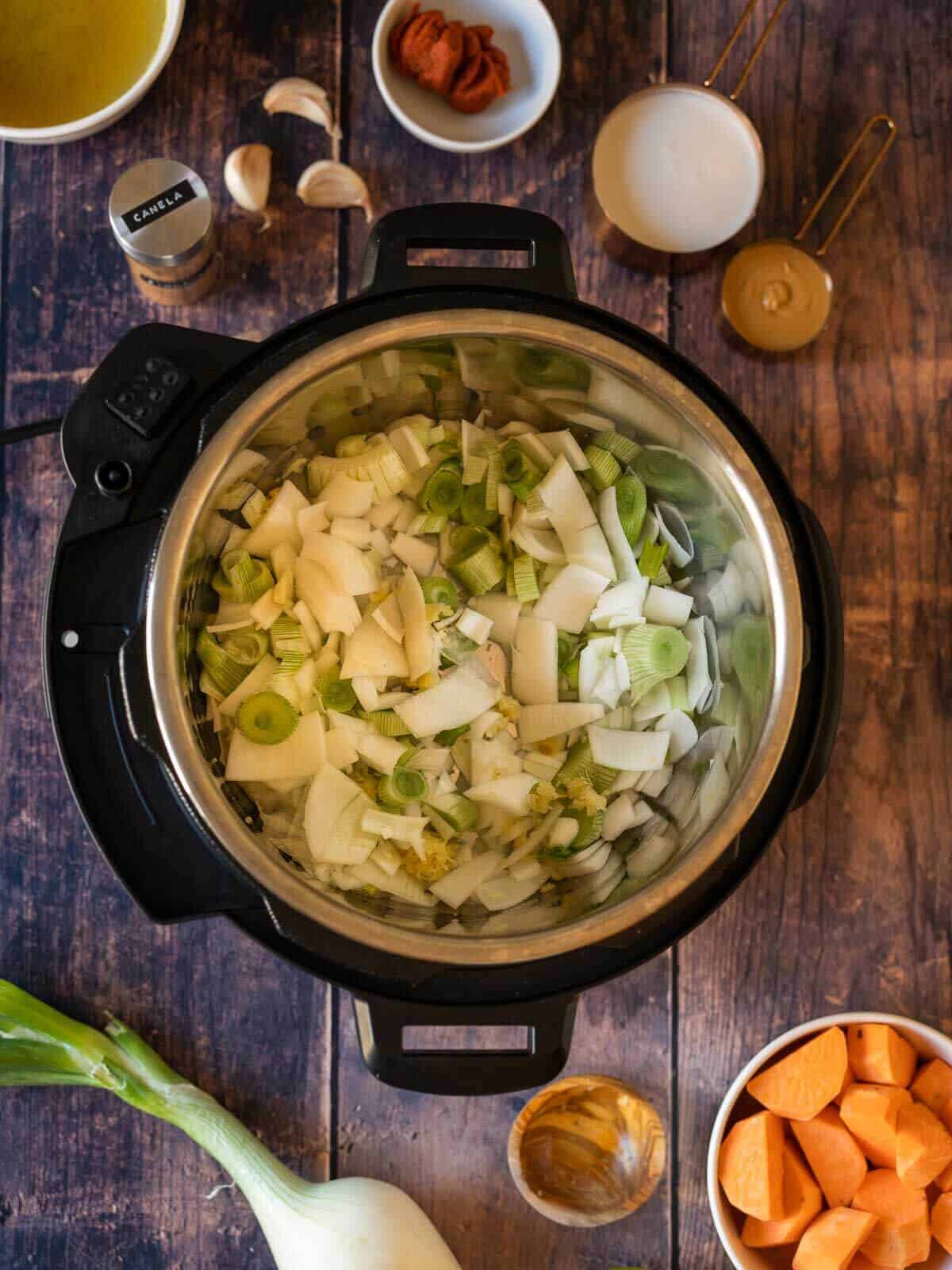 add garlic, ginger and onions into the instant pot or saucepan in the stovetop