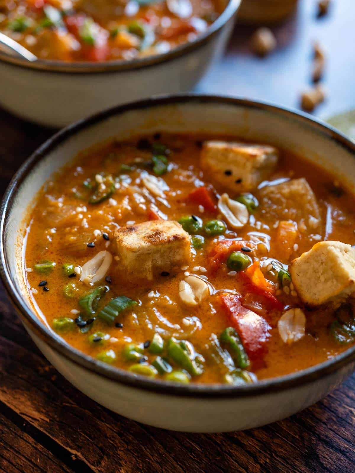 serve the massaman curry with crispy tofu on top and a dash of lemon juice.