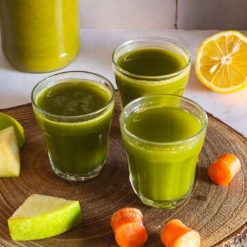 three apple lemon carrot spinach juice shots featured.