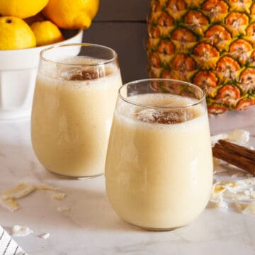 two glasses of served arroz con piña horchata with almond milk featured.