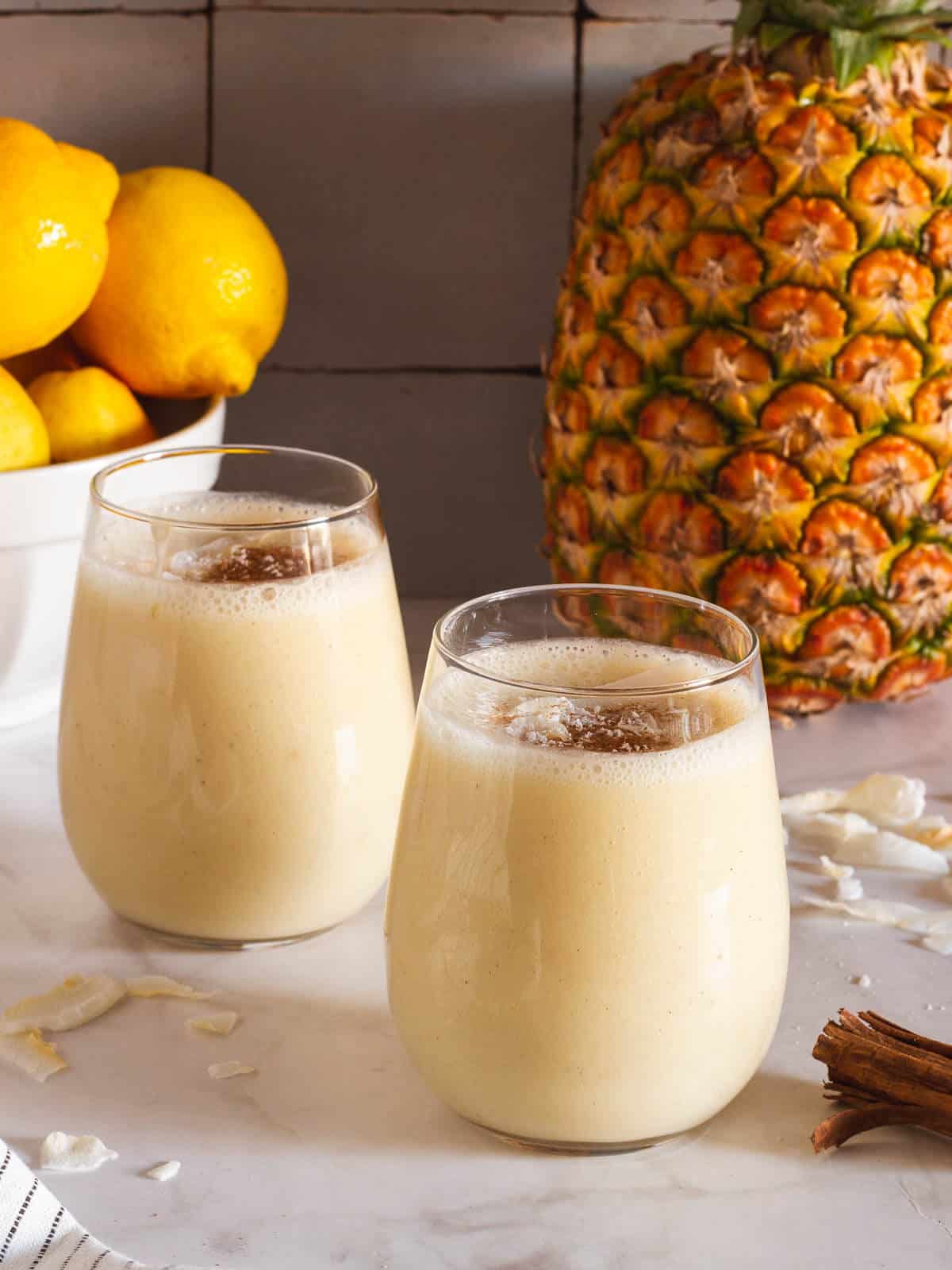 two glasses of served arroz con piña horchata with almond milk.