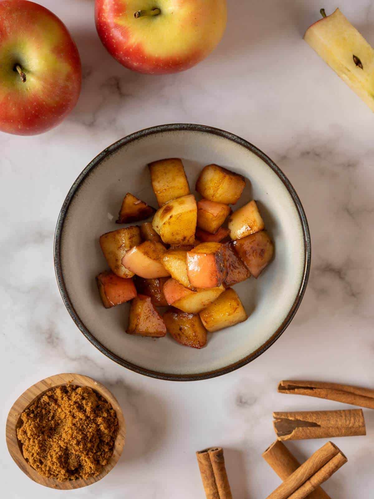 reserved golden brown apples in bowl.