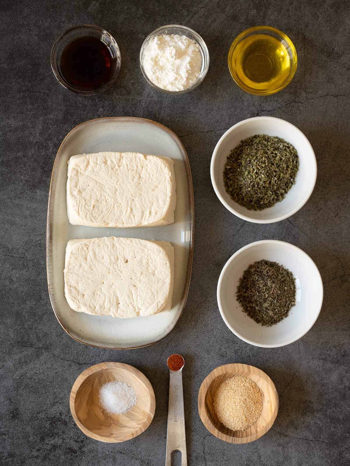 ingredients to make crispy air fryer tofu nuggets with mediterranean marinade.