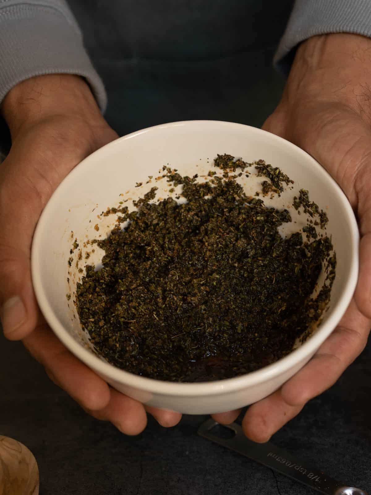 bowl with mixed mediterranean marinade ingredients.