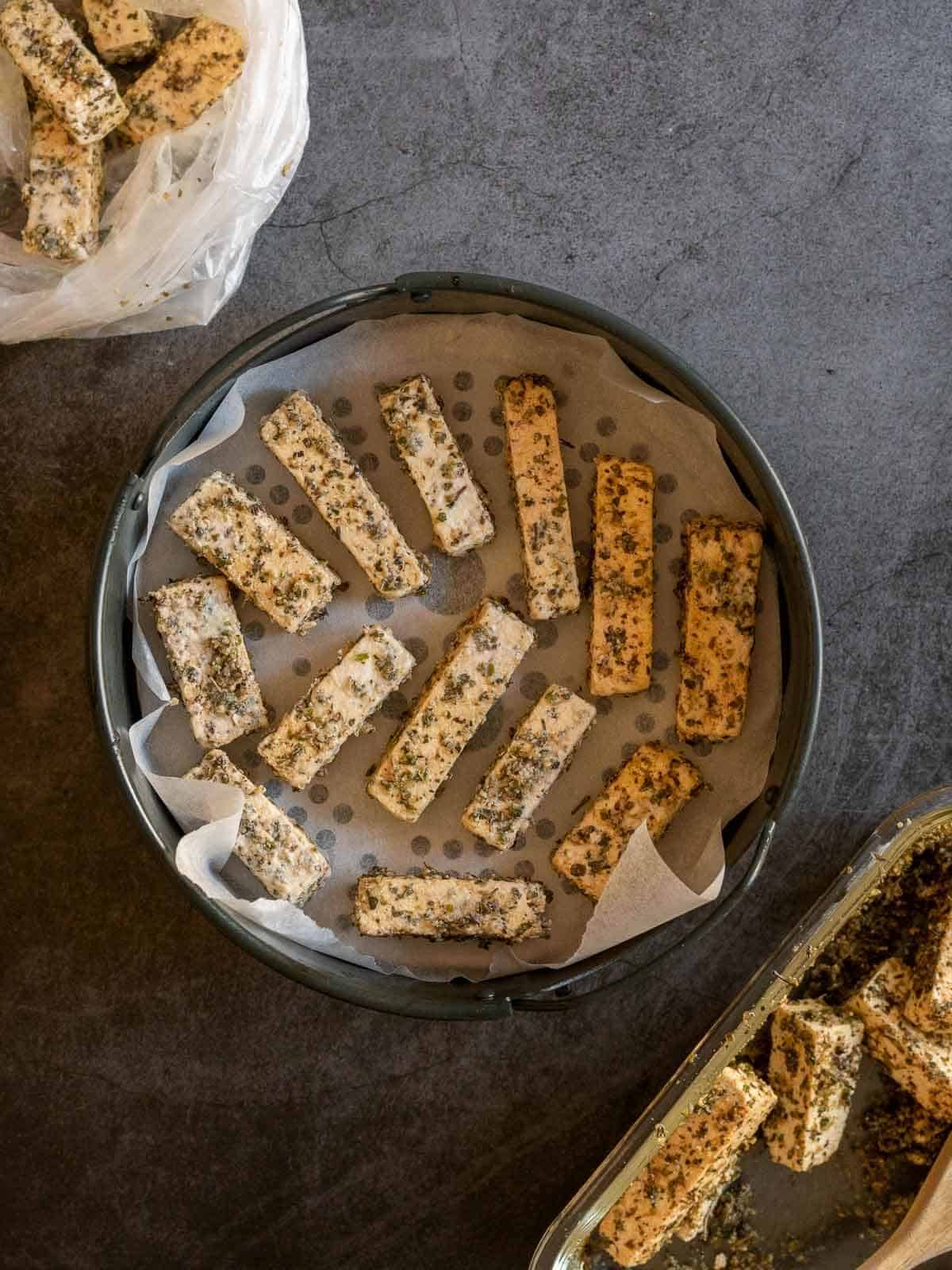 place tofu strips in the air fryer basket.