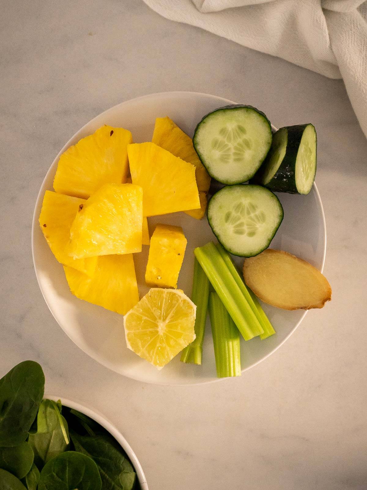 pineapple ginger juice chopped ingredients on a bowl.