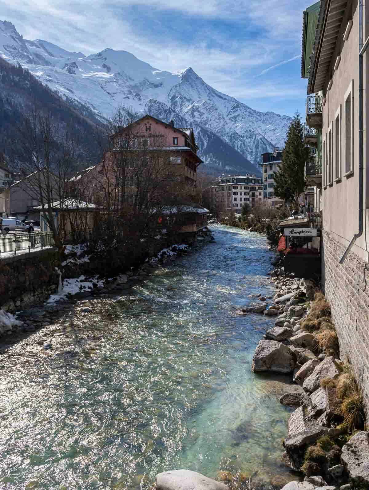 walking by the river crossing the town, one of the best things to do in Chamonix.
