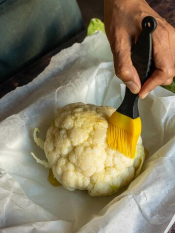 brush the cauliflower head to coat evenly.