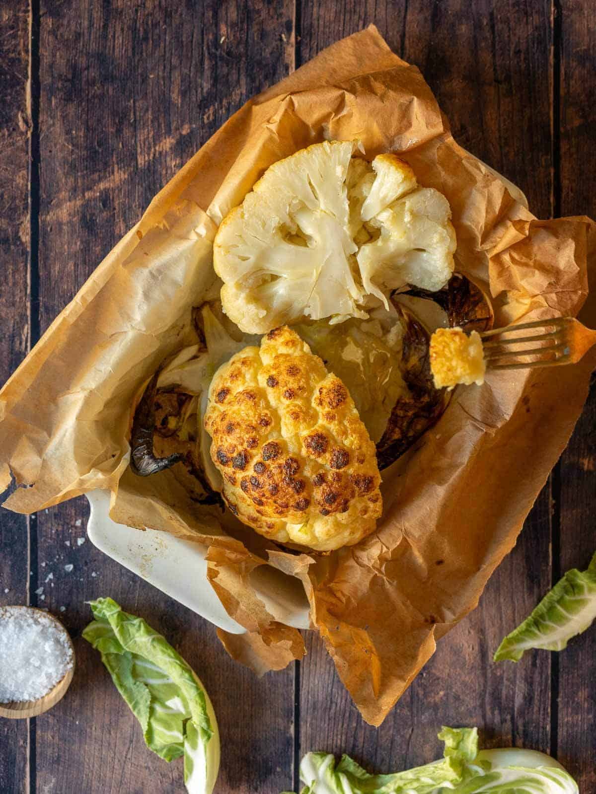 halved roasted whole cauliflower head.