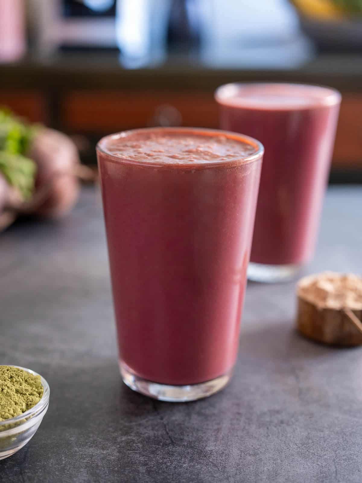 two long glasses of chilled pre-workout smoothie.