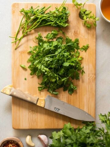 remove the stems from parsley and carrot tops.