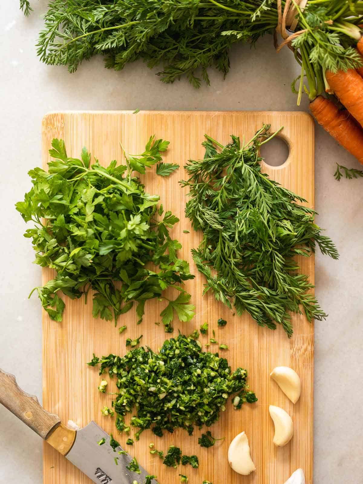finely chop garlic, carrot greens and parsley.