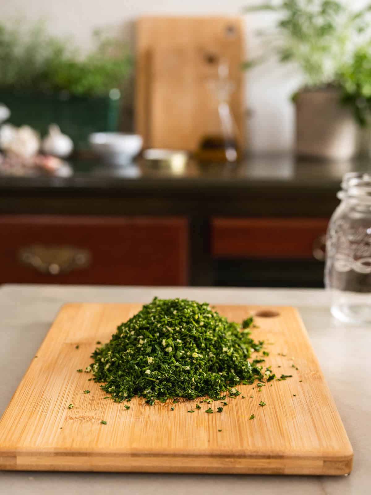 chop together parsley, carrot greens, and garlic until completely mixed.