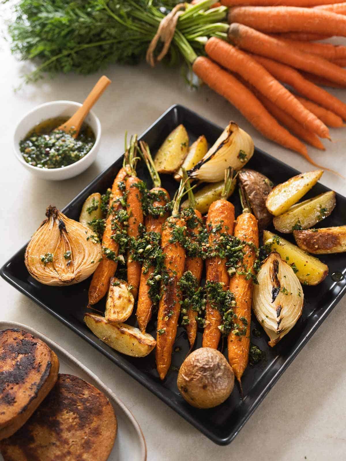 roasted vegetables with carrot greens chimichurri on top.