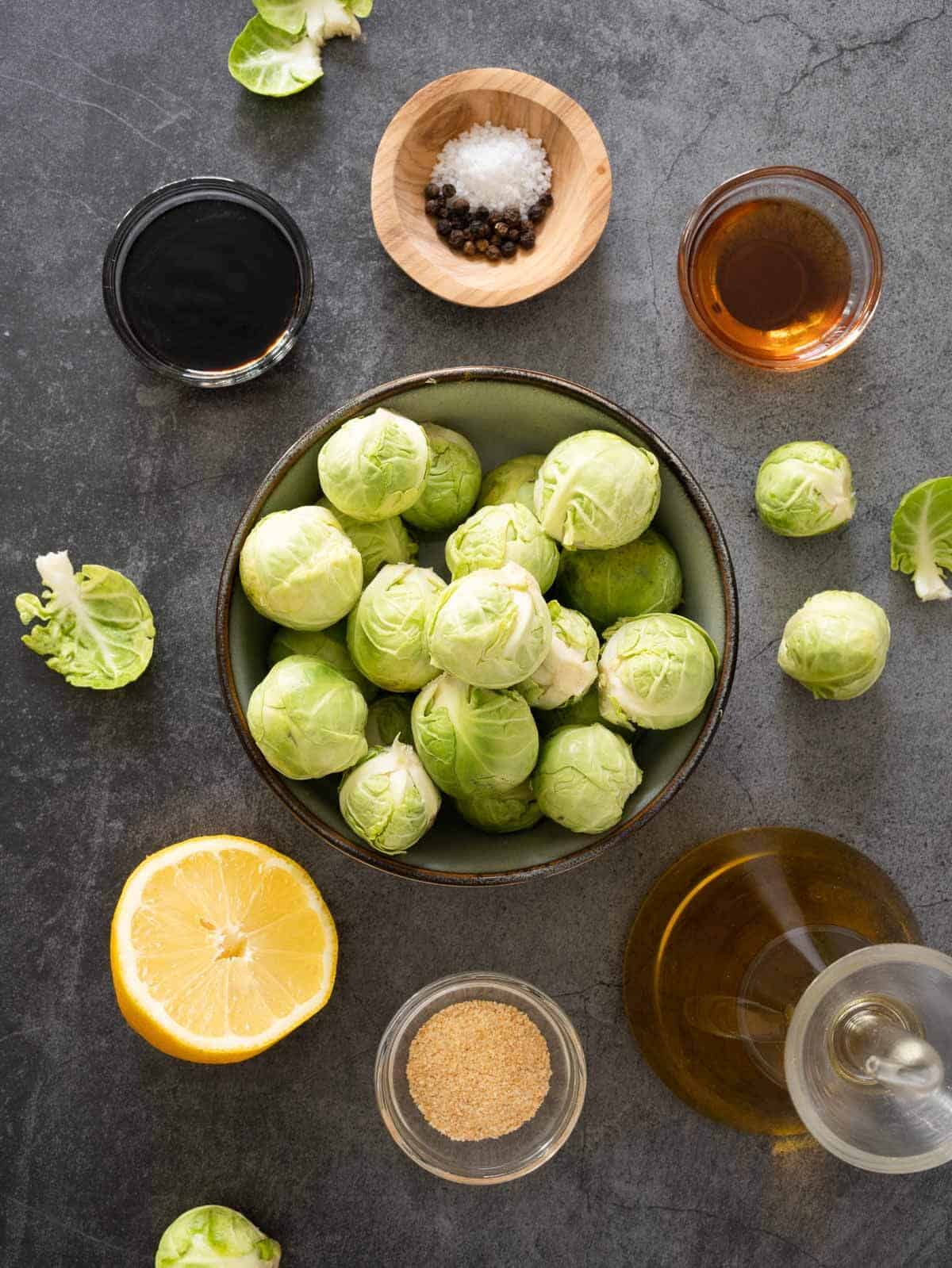 ingredients to make roasted balsamic lemon marinated Brussels spouts.