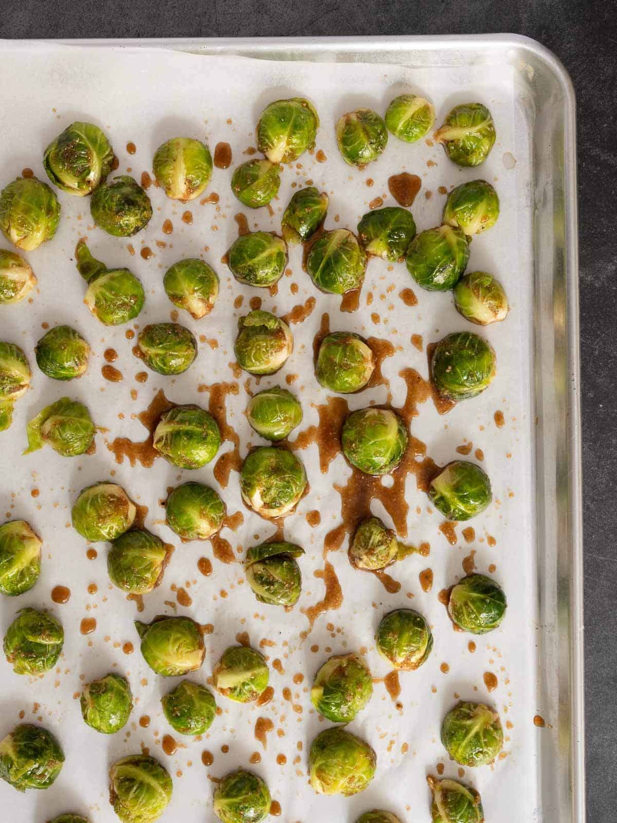spread the marinated Brussels sprouts evenly on a sheet pan.