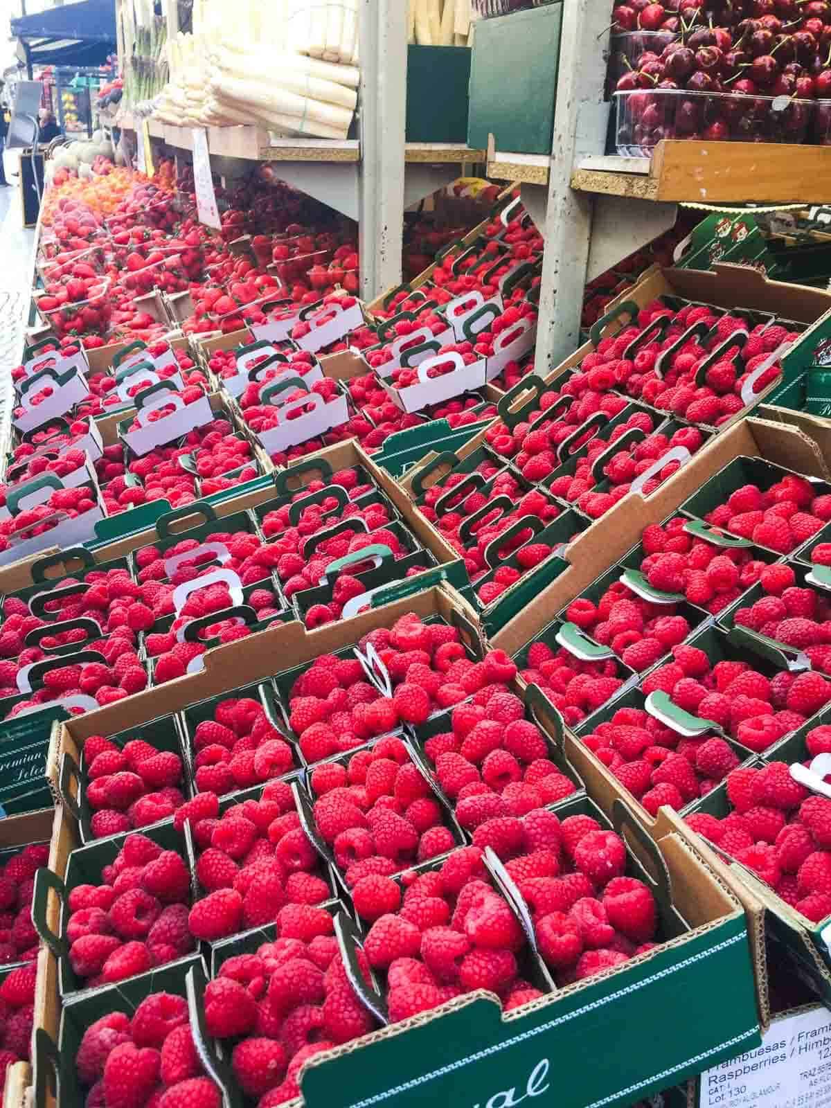 raspberries in farmers market boxes.