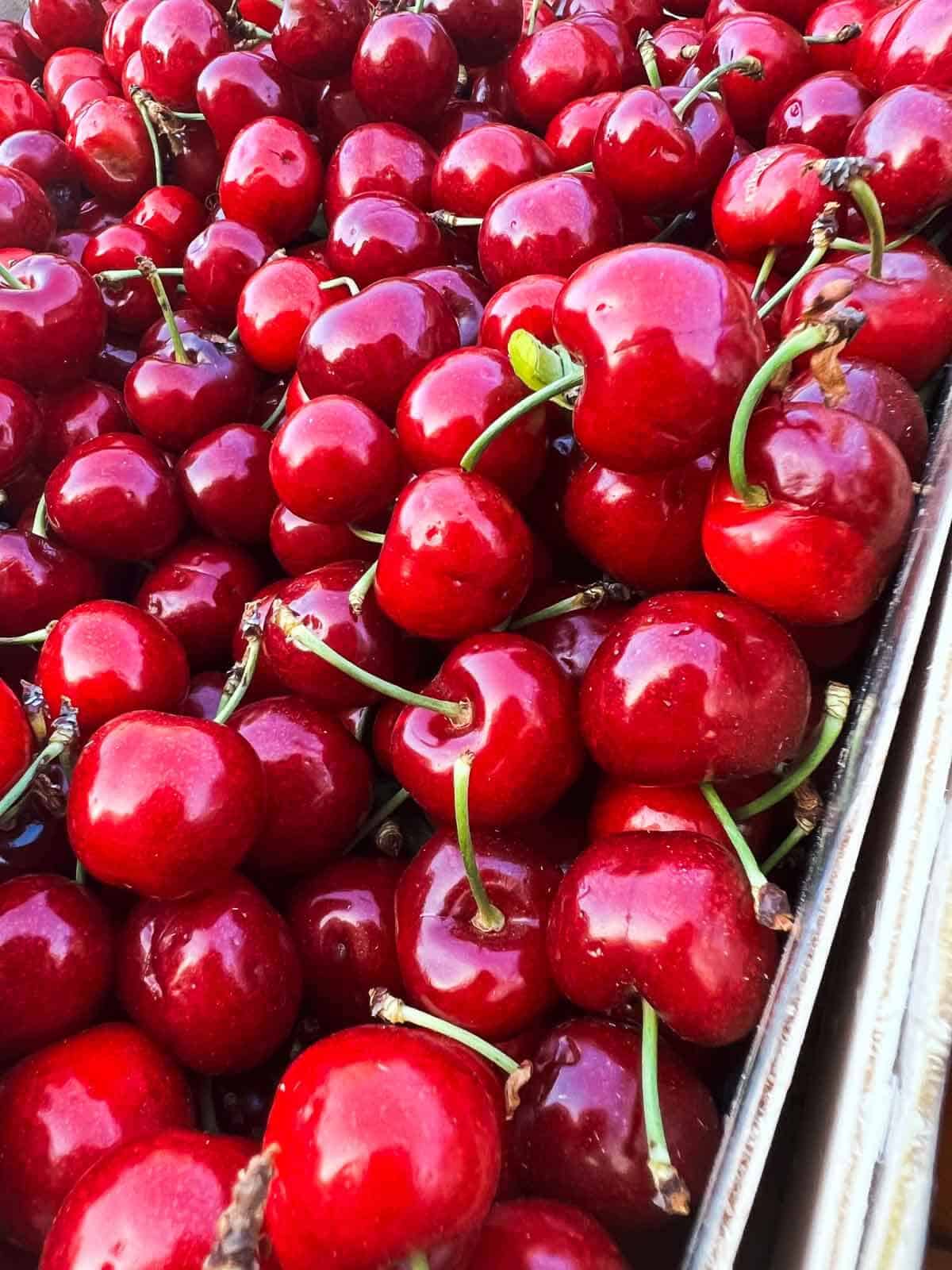 cherries in a box in the farmers market.