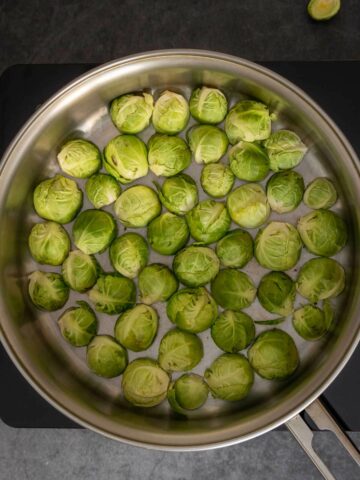 heat coconut oil a put halved Brussels sprouts face down.