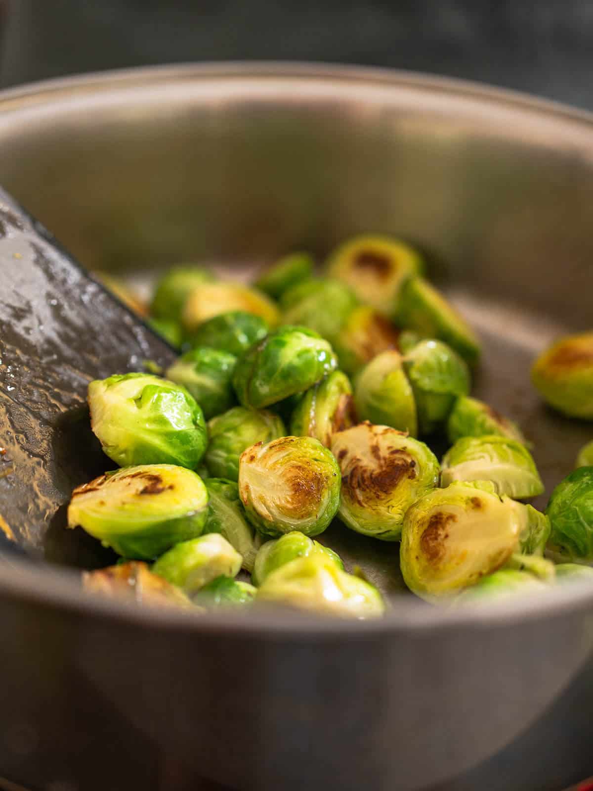 stir with a spatula, trying to keep the sprouts shape and remove as little leaves as possible