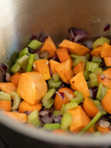 stir frying the vegetables in a saucepan.