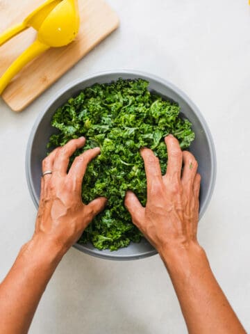 massaging kale with lemon juice.