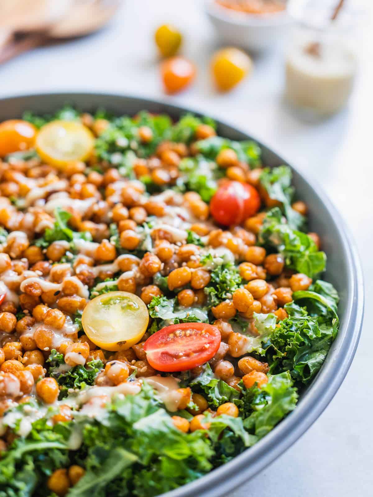 close up of the crispy chickpea kale salad with tahini dressing.