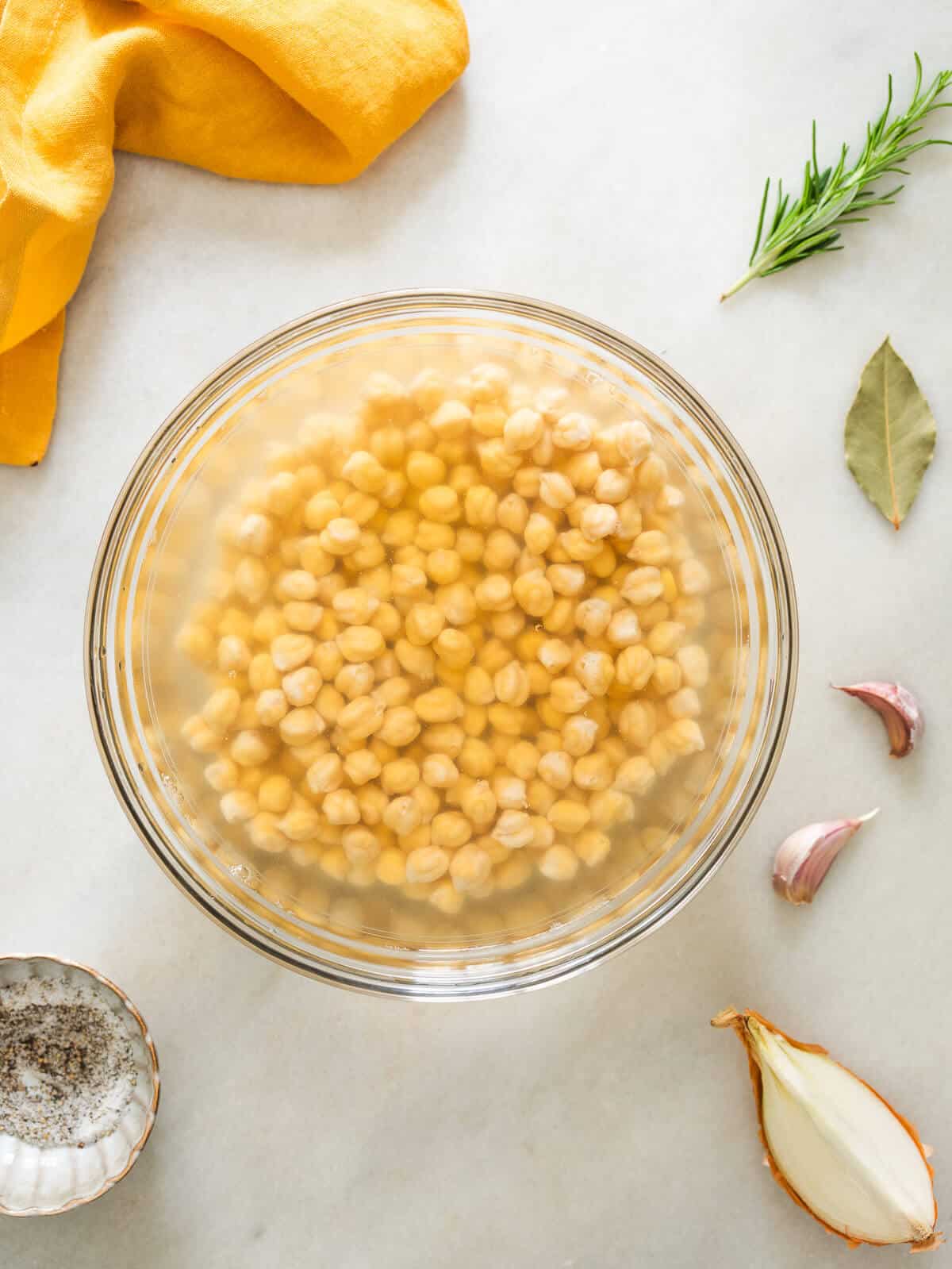 soaking chickpea in a mixing bowl with water.