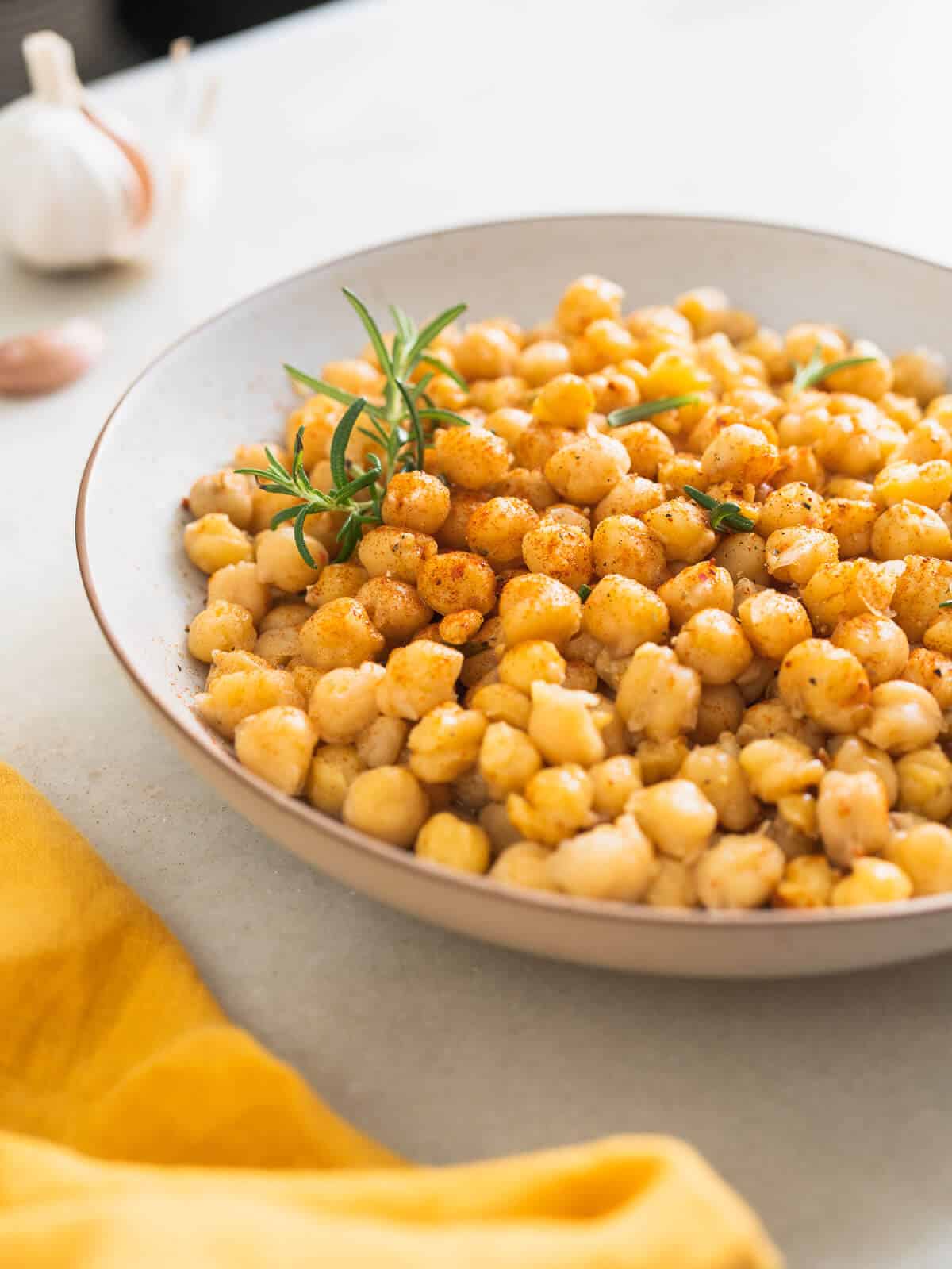 cooked chickpeas seasoned in a bowl.