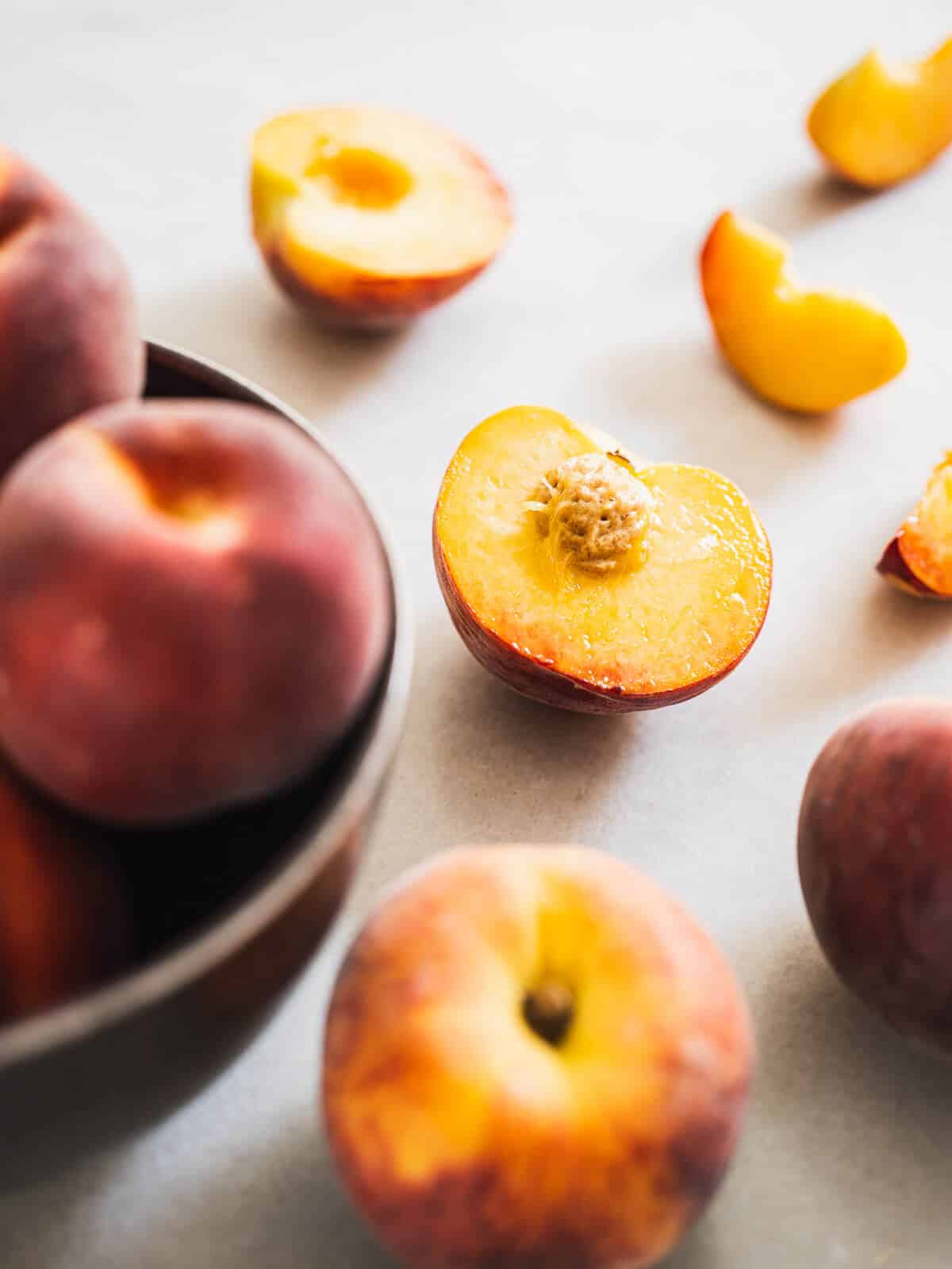 sliced peached on a table.